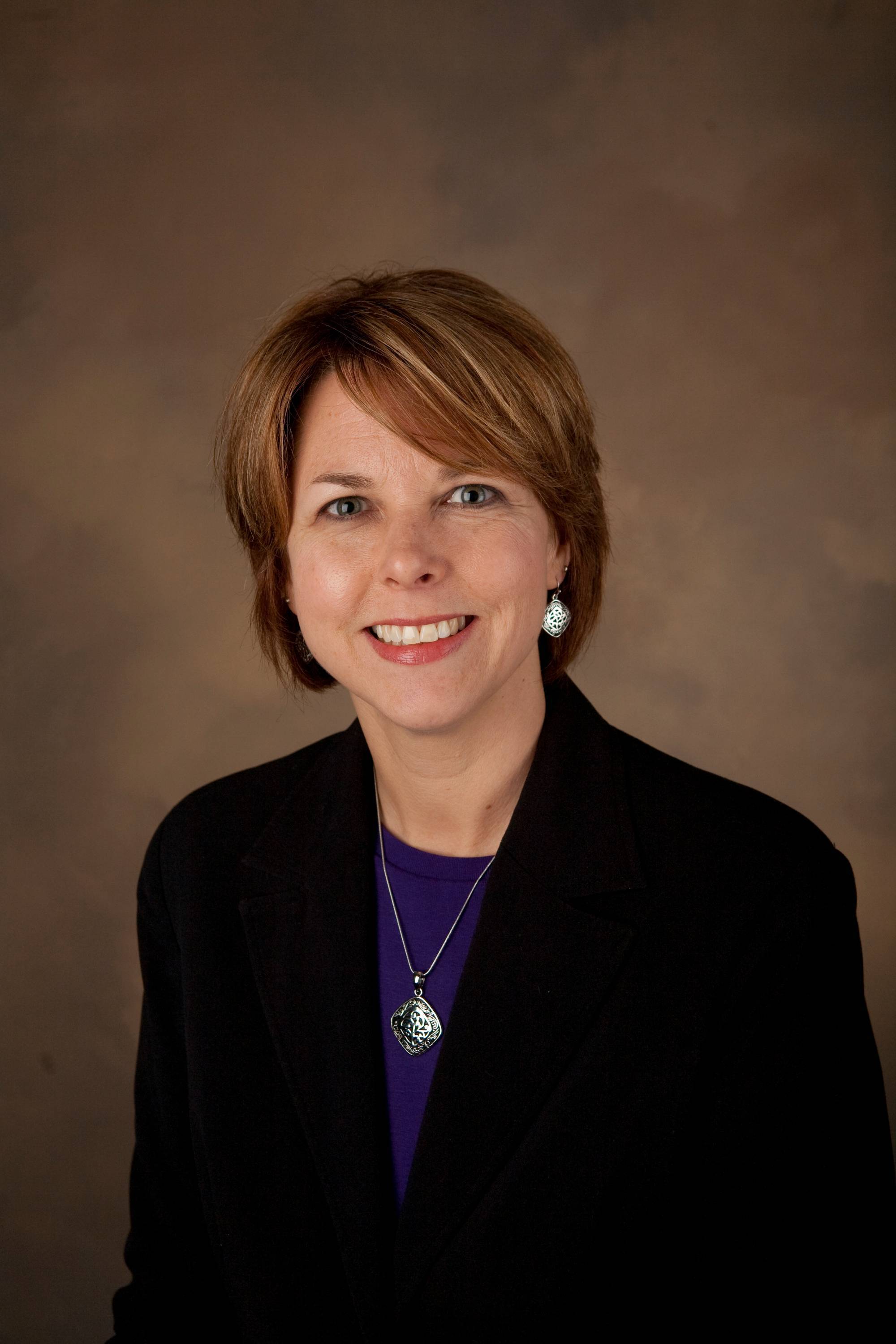 a headshot of Esther Ricco